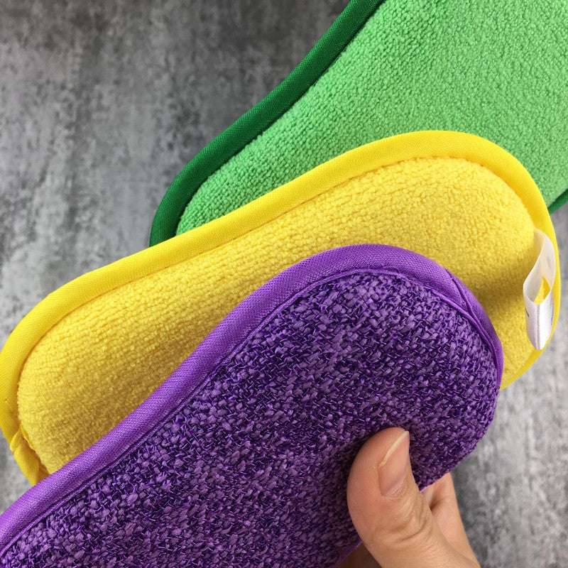 Kitchen cleaning towel set in purple, yellow, and green with textured cleaning surfaces and fabric edges held by hand