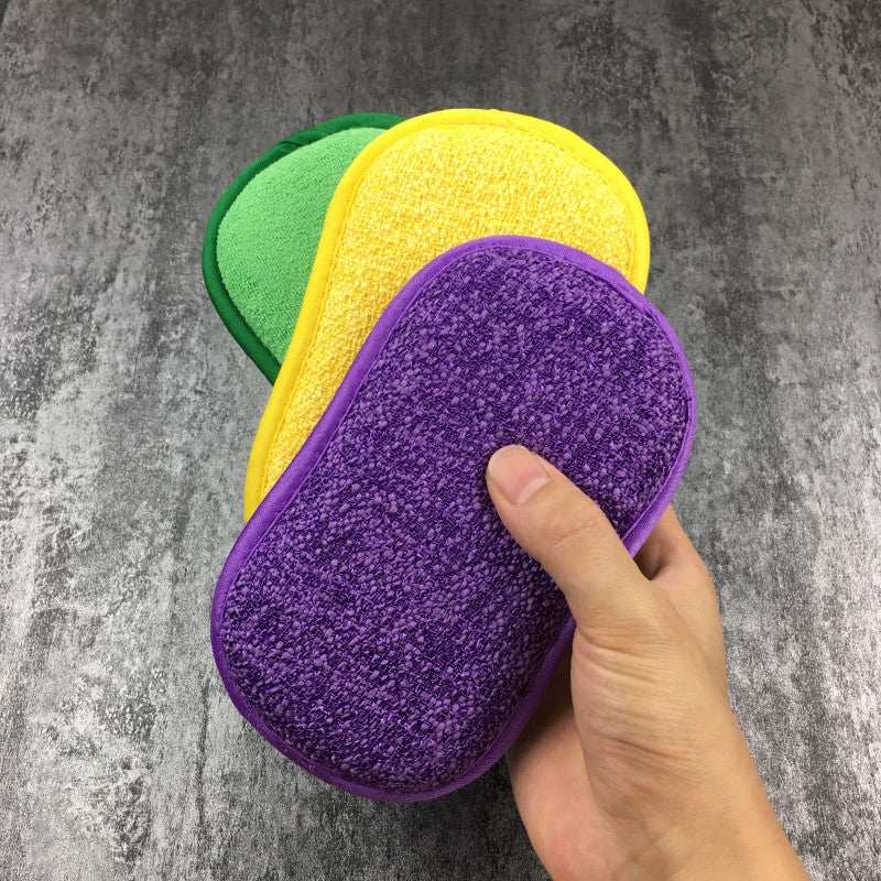 Kitchen cleaning towel pack with textured fabric in green, yellow, and purple colors held in hand against gray textured background