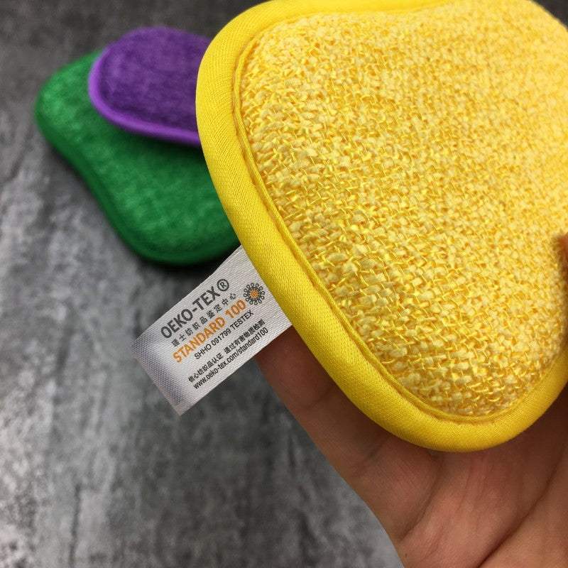 Kitchen cleaning towel pack with yellow, green, and purple textured cleaning pads featuring OEKO-TEX certification tags